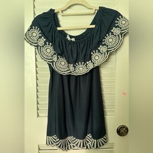 Blue shirt with scalloped bottom. Never worn. Can be worn off shoulders.